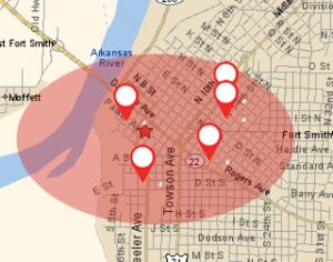 Map showing a section of Fort Smith with a red shaded area and multiple location pins, likely indicating specific points of interest or activity within the area.